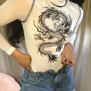 A black and white bodysuit with a dragon